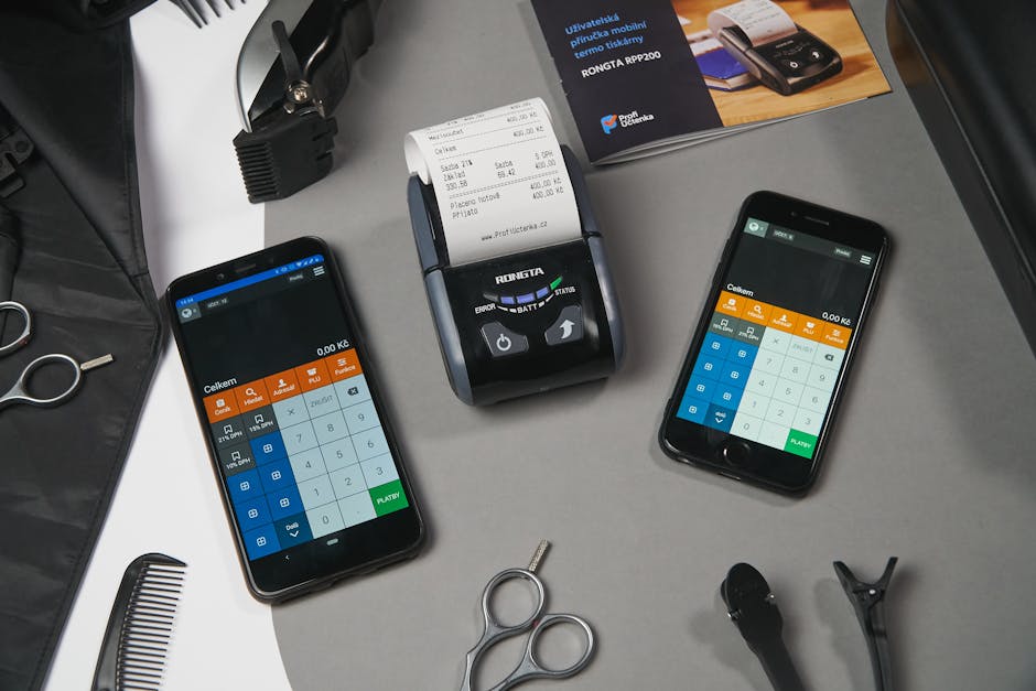 Receipts, smartphone, and laptop on a small business desk
